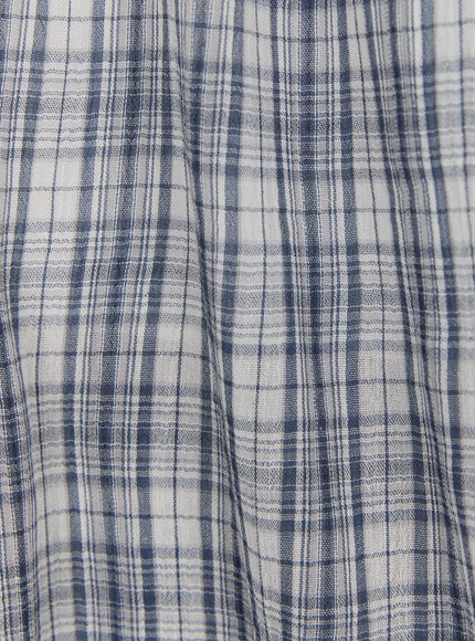 Plaid Flare Maxi Skirt CU519 fabric macro close-up in navy blue colorway, showing lightweight open-weave plaid textile with fine check pattern and subtle texture.