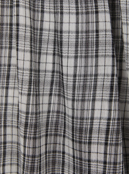 Plaid Flare Maxi Skirt CU519 fabric macro close-up in black and white colorway, revealing woven plaid structure with fine grid lines and slightly crinkled lightweight texture.