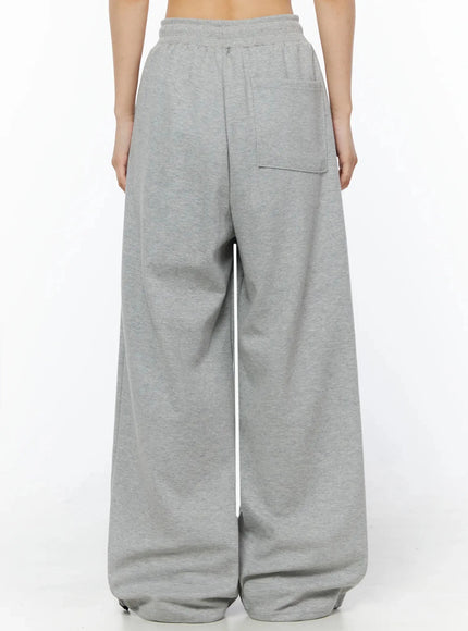 404 Error Graphic Sweatpants IL516 Gray back shot on model cropped at waist showing clean back panel with back patch pocket and elastic waistband