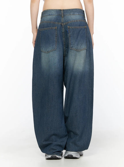 Ace Washed Wide Leg Jeans CL522 Dark blue back view on model, two patch pockets with contrast stitching, exaggerated wide balloon leg hem pooling at silver sneakers