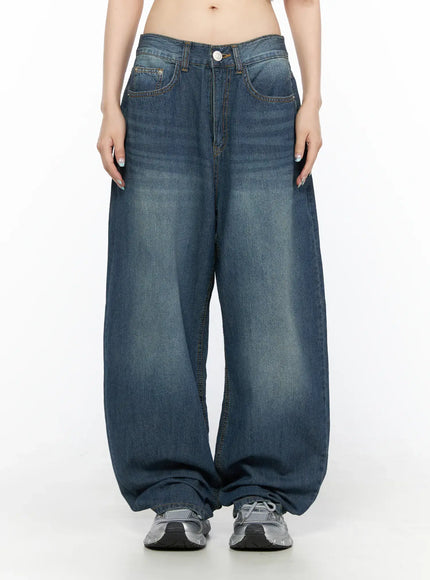 LEWKIN Ace Washed Wide Leg Jeans CL522 Dark blue front view on model size S, low-rise waistband with button closure, faded wash balloon silhouette, worn with silver sneakers