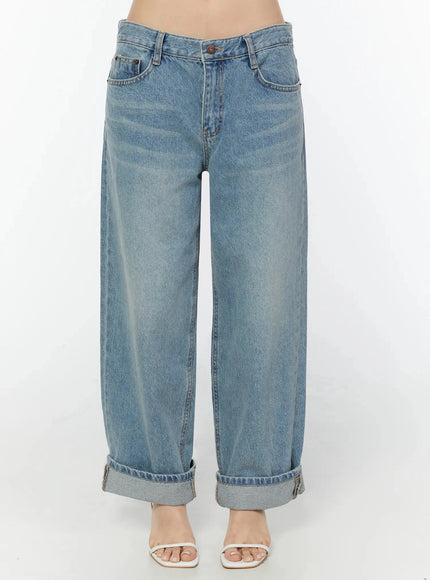 LEWKIN Adeya Cuffed Straight Jeans IU524 Blue Size S front crop shot on model showing low-rise waist, button fly, faded wash, and cuffed hem with white heeled sandals