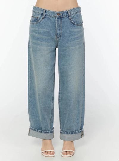 LEWKIN Adeya Cuffed Straight Jeans IU524 Blue Size S front crop shot on model showing low-rise waist, button fly, faded wash, and cuffed hem with white heeled sandals