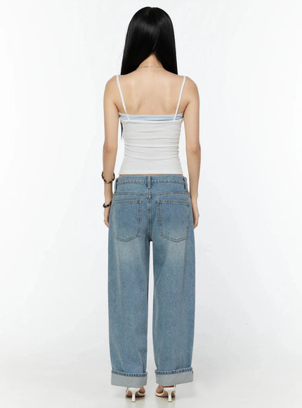 Adeya Cuffed Straight Jeans IU524 Blue full-body back shot on model wearing white cami top showing rear pockets, wide-leg silhouette, and cuffed hem with white heels