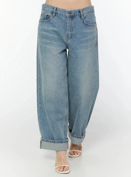 Adeya Cuffed Straight Jeans IU524 Blue front waist-to-hem shot on model showing low-rise waistband, front pockets, barrel-leg shape, and cuffed hem with white heeled sandals