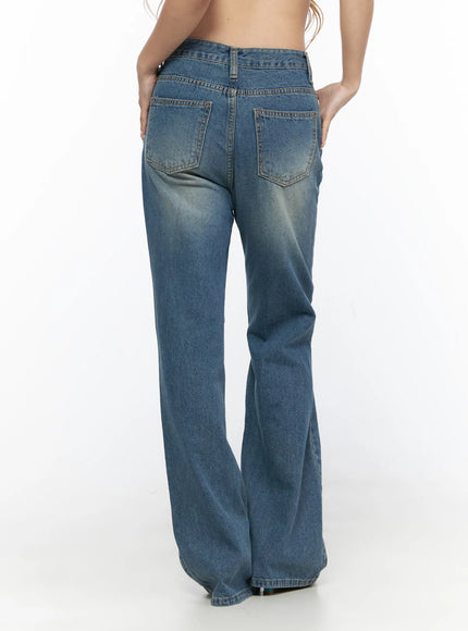Ahmad Distressed Flared Jeans CL528 Blue back full-body shot on model showing two back pockets faded wash wide flare leg hem and teal sandals