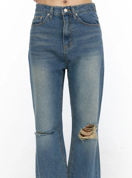 Ahmad Distressed Flared Jeans CL528 Blue close-up front detail shot on model showing waistband five-pocket construction faded wash and frayed knee rips