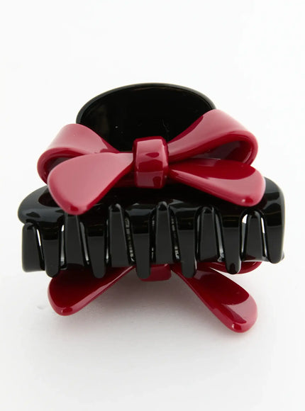 Amber Mix Hair Clip IL503 Black and Red side-front view showing glossy black claw teeth and red bow accent with spring mechanism visible