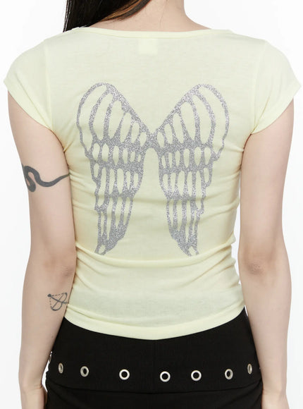 Angel Slim T-Shirt IL522 Light yellow back close-up model showing large silver glitter angel wings graphic printed across back of slim ribbed tee