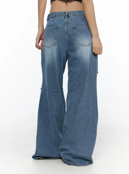 Anyae Mid-Wash Knee Distressed Wide Jeans CL510 blue back shot cropped at waist on model showing double back pockets faded wash and wide leg hem
