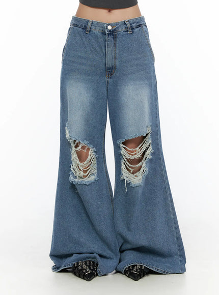Anyae Mid-Wash Knee Distressed Wide Jeans CL510 blue front waist-to-hem shot on model showing low-rise waistband button fly large knee rips and voluminous wide leg denim
