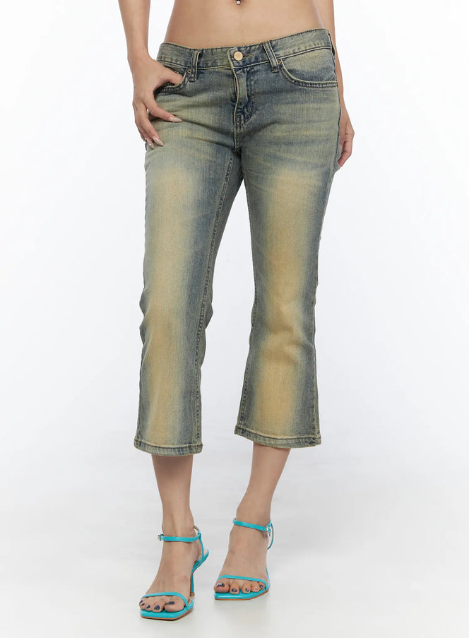 LEWKIN Archie Deep Tint Wash Capri Jeans CL528 Blue front view on model size S hand in pocket low-rise cropped flare with vintage yellow-tinted wash worn with teal heeled sandals