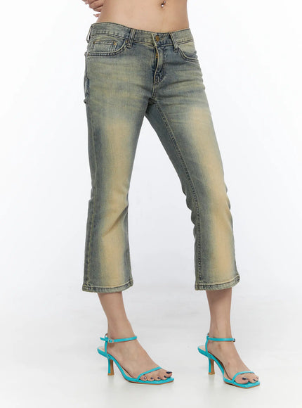 Archie Deep Tint Wash Capri Jeans CL528 Blue side view on model showing low-rise fit cropped flare hem vintage tint wash and side pocket detailing with teal heeled sandals