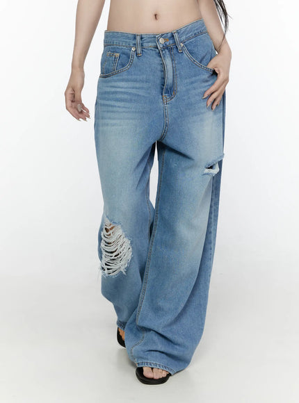 Arden Distressed High-Waist Baggy Jeans IL522 Blue angled front view on model showing knee rip and large frayed thigh distressing with wide-leg fall