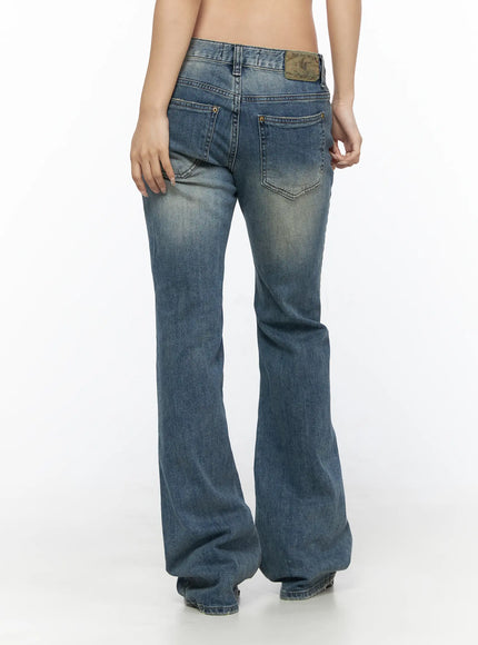 Arian Loose Flared Jeans CL528 Blue back view on model showing rear pockets, vintage leather patch label, faded wash, and flared leg