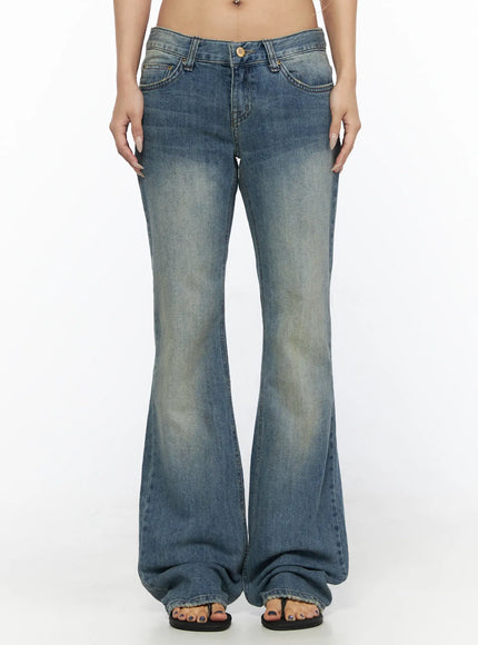 LEWKIN Arian Loose Flared Jeans CL528 Blue front view on model size S showing low-rise waist, vintage wash denim, and wide flared leg hem with sandals