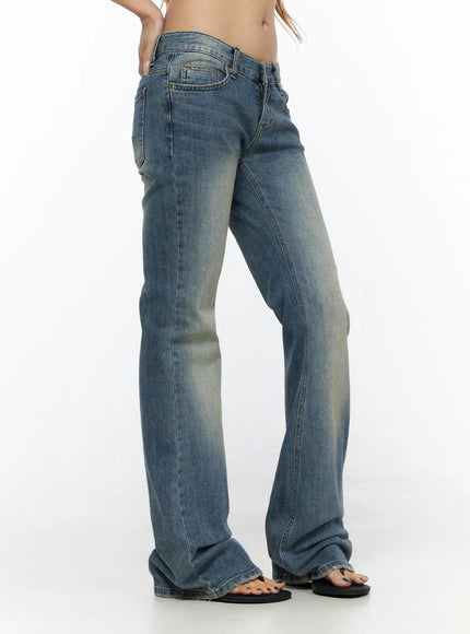 Arian Loose Flared Jeans CL528 Blue side view on model showing slim thigh silhouette, faded wash denim texture, and slight flare at ankle