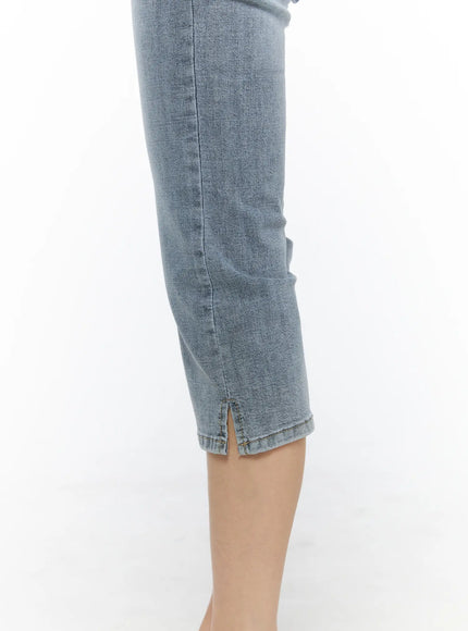 Aris High-Waist Capri Jeans CU530 Light blue side close-up detail of hem showing small slit opening and stitched cuff on bare leg