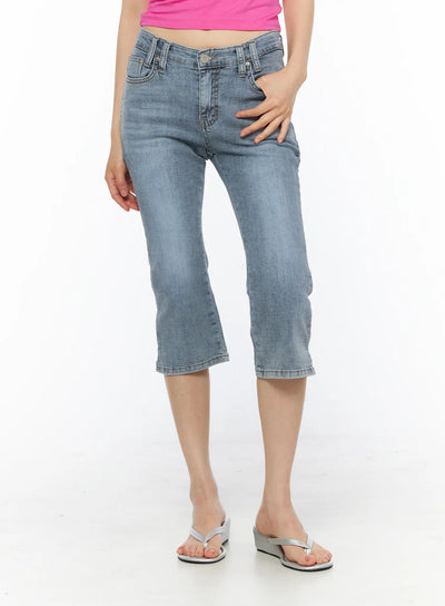 LEWKIN Aris High-Waist Capri Jeans CU530 Light blue front view on model wearing pink top and silver wedge sandals, washed denim capri fit