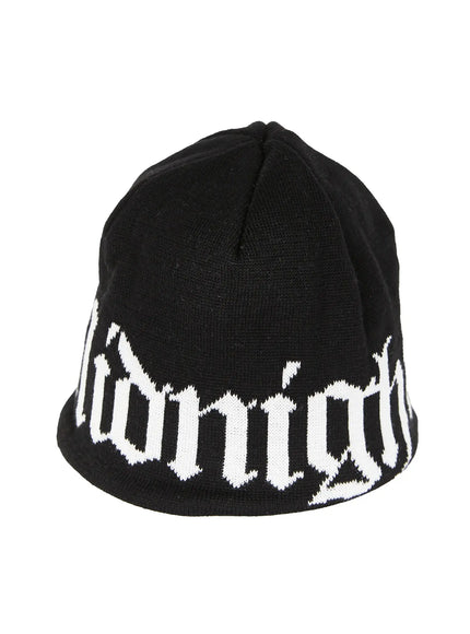 Aspen 1988 beanie IL503 Black product flat shot angled view showing white gothic script jacquard lettering on black knit beanie
