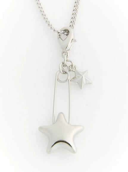 Astra Star Pin Necklace IL522 Silver detail close-up showing puffed star charm safety pin pendant and small star on curb chain
