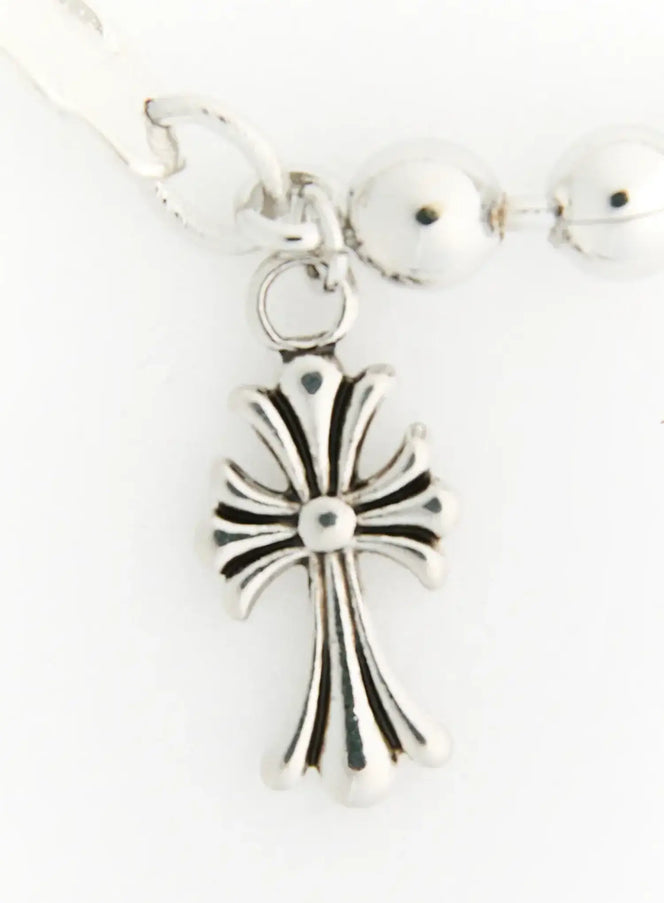 Atlas Large Cross Bracelet IL522 Silver close-up detail of antique-finish fleur cross charm with engraved ridges and center bead accent