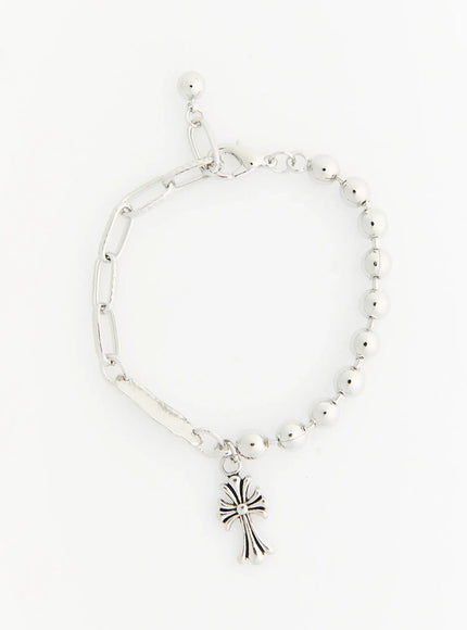 Atlas Large Cross Bracelet IL522 Silver flat-lay full view showing asymmetric design with paperclip chain half and ball bead chain half with cross charm
