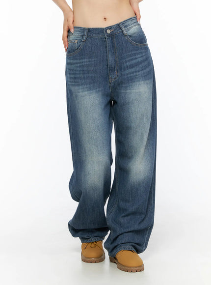 Auralie Vintage Washed Wide Leg Jeans CL502 Blue front cropped view on model highlighting mid-rise waistband wide leg fit and heavy faded wash