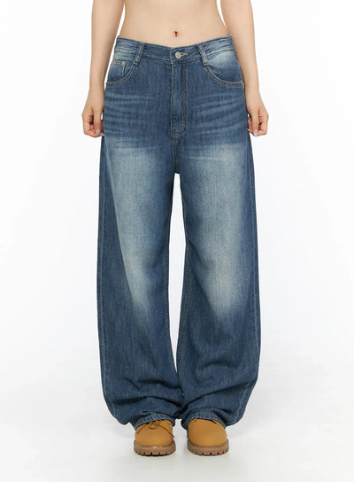 LEWKIN Auralie Vintage Washed Wide Leg Jeans CL502 Blue front view on model size S showing washed denim low-rise waist with tan boots
