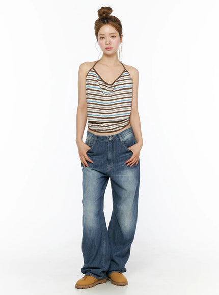 Auralie Vintage Washed Wide Leg Jeans CL502 Blue front full-body view on model hands in pockets styled with striped halter top and tan boots