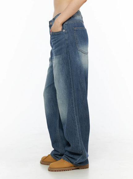 Auralie Vintage Washed Wide Leg Jeans CL502 Blue side view on model showing wide-leg silhouette hand in pocket with tan chunky boots