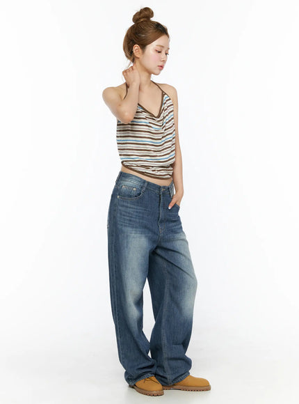 Auralie Vintage Washed Wide Leg Jeans CL502 Blue three-quarter side view on model looking down hand raised to neck showing wide-leg volume