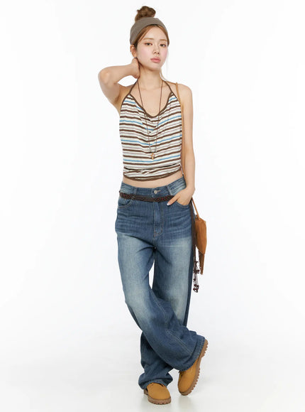 Auralie Vintage Washed Wide Leg Jeans CL502 Blue full-body styled shot on model wearing striped halter top with braided belt and fringe bag