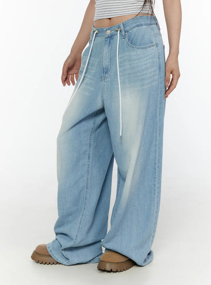 Aurelie Drawstring Washed Wide Leg Jeans CL507 Light blue side shot on model with hands in pockets showing oversized wide leg silhouette and drawstring