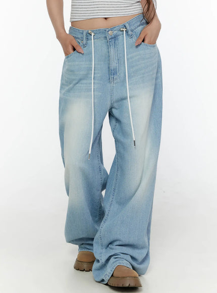 LEWKIN Aurelie Drawstring Washed Wide Leg Jeans CL507 Light blue front close-up on model showing white drawstring waist detail and faded denim texture