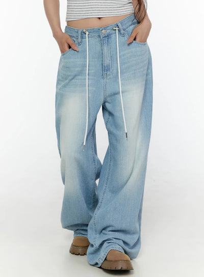 LEWKIN Aurelie Drawstring Washed Wide Leg Jeans CL507 Light blue front close-up on model showing white drawstring waist detail and faded denim texture