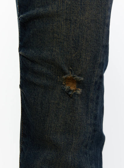 Aveli Vintage Low-Rise Flare Jeans CL515 Dark blue close-up knee detail showing distressed ripped hole with frayed edges on dark denim