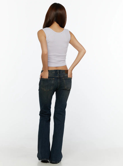 Aveli Vintage Low-Rise Flare Jeans CL515 Dark blue full-body back model shot with white crop tank top hands in back pockets flare leg