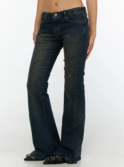 Aveli Vintage Low-Rise Flare Jeans CL515 Dark blue side view on model with white crop tank top showing flare hem and low-rise fit