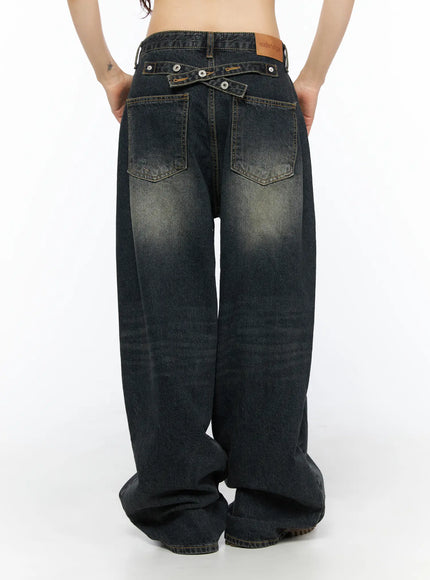 Avie Vintage Wash Wide Leg Jeans CU530 Dark blue back full view on model showing wide-leg silhouette cross-strap waistband back pockets and vintage wash fading