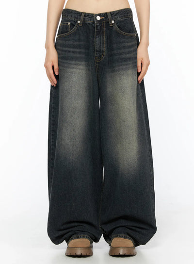 LEWKIN Avie Vintage Wash Wide Leg Jeans CU530 Dark blue front view on model cropped at waist showing wide-leg silhouette faded wash and button fly