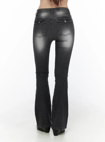 Avielle Classic Bootcut Jeans CL527 Black back view on model, displaying dual snap-button back pockets and flared hem with washed denim finish