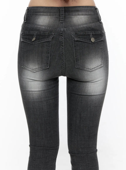 Avielle Classic Bootcut Jeans CL527 Black close-up back view on model, showing dual snap-button back pockets with whiskering and washed denim texture