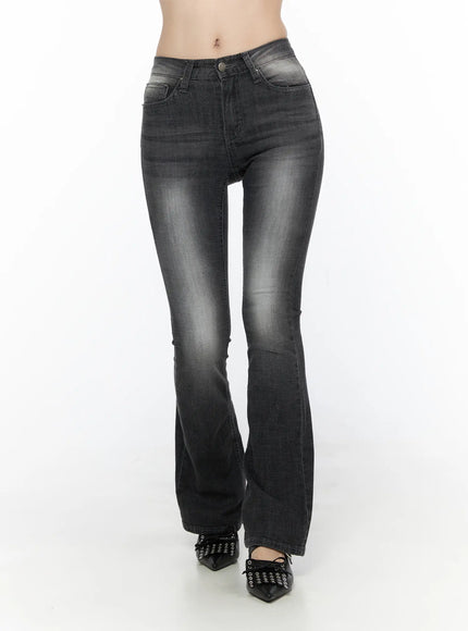 LEWKIN Avielle Classic Bootcut Jeans CL527 Black front view on model, washed black denim flare hem, worn with black bow flats, Size S