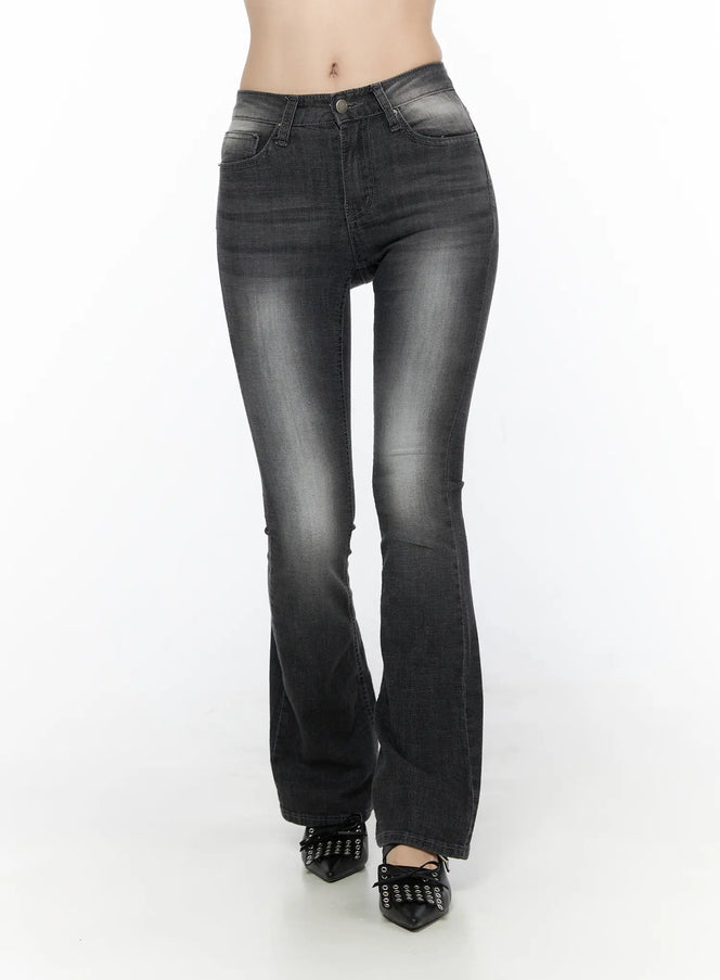 LEWKIN Avielle Classic Bootcut Jeans CL527 Black front view on model, washed black denim flare hem, worn with black bow flats, Size S