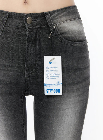 Avielle Classic Bootcut Jeans CL527 Black close-up front detail on model, featuring metal button, zipper fly, coin pocket, and Stay Cool fabric hang tag