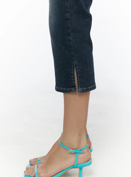 Axel Slit Capri Jeans CL510 dark blue close-up detail of cropped hem with side slit opening styled with teal strappy heeled sandals