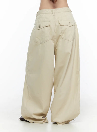 LEWKIN Back Pocket Wide Leg Pants CL524 Beige back view on model showing flap back pockets with button and zip hardware, wide-leg silhouette, cotton fabric