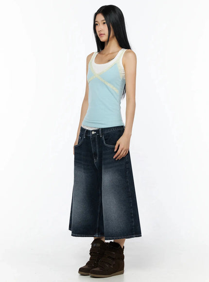 Back Print Jorts IL509 Dark blue three-quarter front view on model in blue lace-trim tank, hand on pocket, wide-leg washed denim, brown wedge sneakers