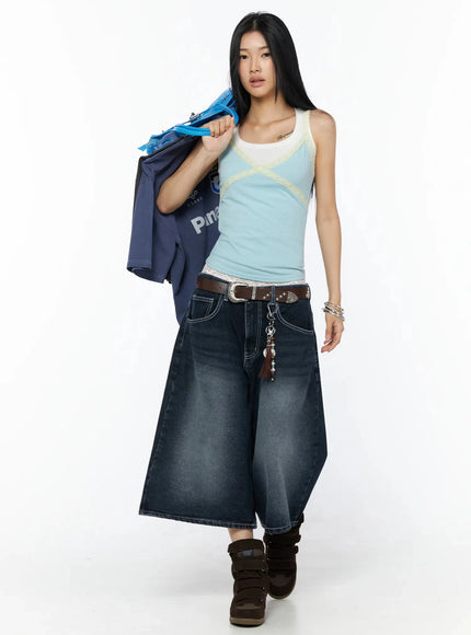 Back Print Jorts IL509 Dark blue full-length editorial front view on model carrying bag over shoulder, western belt with charm, wide-leg silhouette, brown wedge sneakers